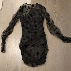 Black party dress. The brand is “h:ours”